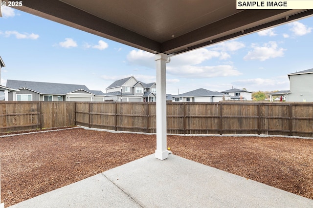 1376 NE Josephine Ct Unit 184, Estacada, OR 97023 - view of yard featuring a patio, a fenced backyard, and a residential view