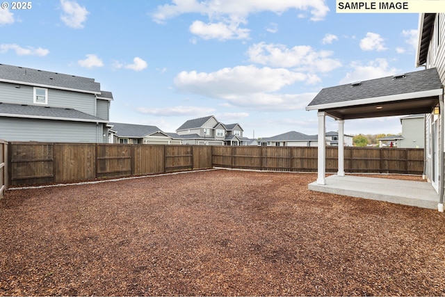 1376 NE Josephine Ct Unit 184, Estacada, OR 97023 - view of yard featuring a residential view, a fenced backyard, and a patio area