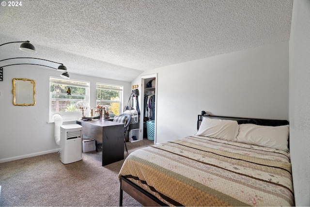 bedroom featuring lofted ceiling, a textured ceiling, a closet, and carpet flooring