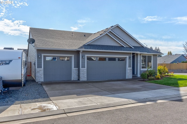 craftsman inspired home with a garage