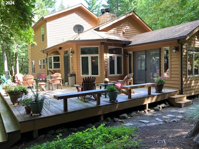 rear view of property featuring outdoor lounge area