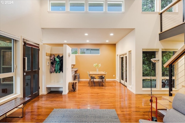 dining area with french doors, light wood-style flooring, recessed lighting, and baseboards