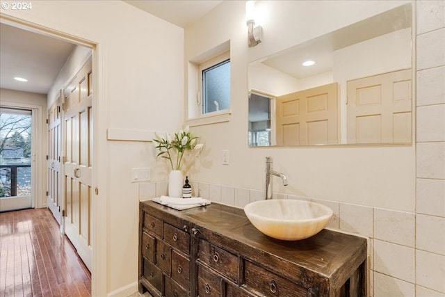 hall with light wood finished floors, recessed lighting, and baseboards