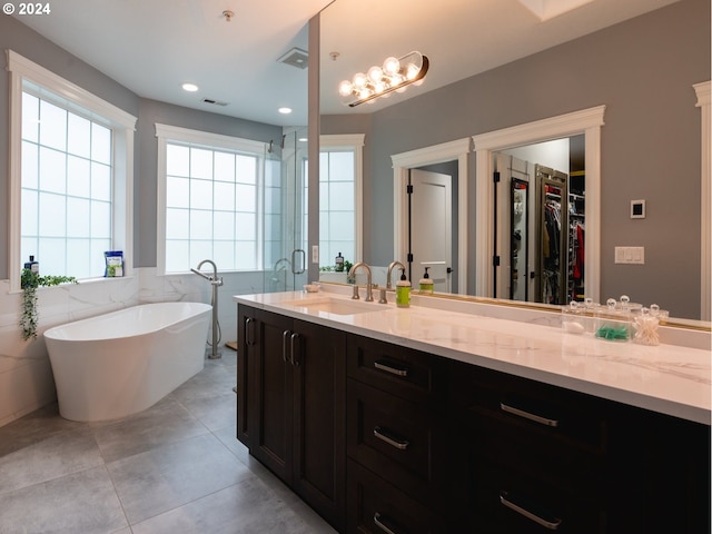 bathroom featuring tile walls, tile patterned flooring, vanity, and shower with separate bathtub