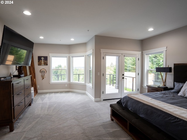 carpeted bedroom featuring access to exterior