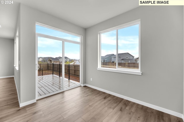 spare room featuring light hardwood / wood-style floors