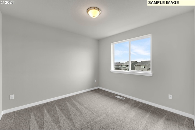 empty room featuring carpet flooring