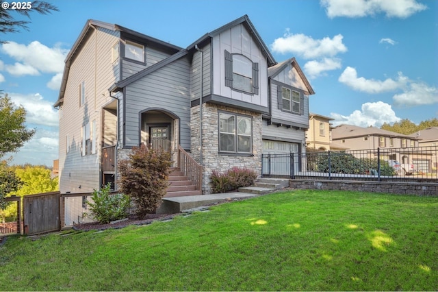 view of front facade featuring a front lawn, an attached garage, fence, and stone siding