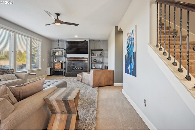 living room with light carpet and ceiling fan