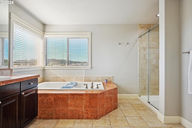 bathroom featuring vanity, separate shower and tub, and tile patterned flooring