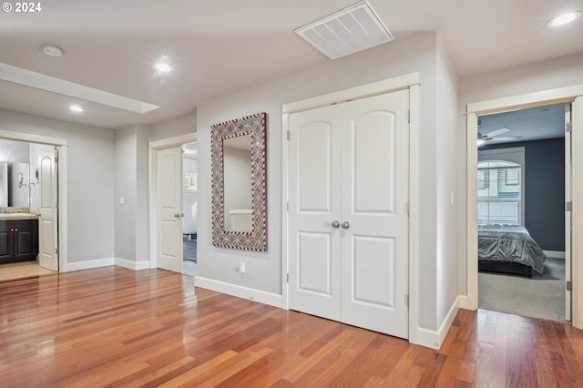 hall featuring sink and wood-type flooring