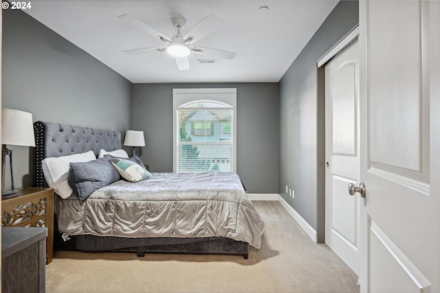 carpeted bedroom featuring ceiling fan