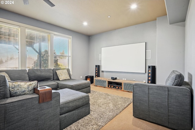 carpeted cinema with ceiling fan