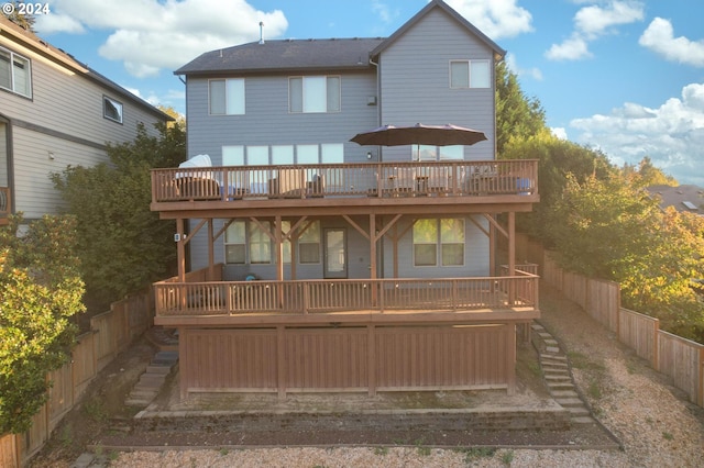 back of property with a deck