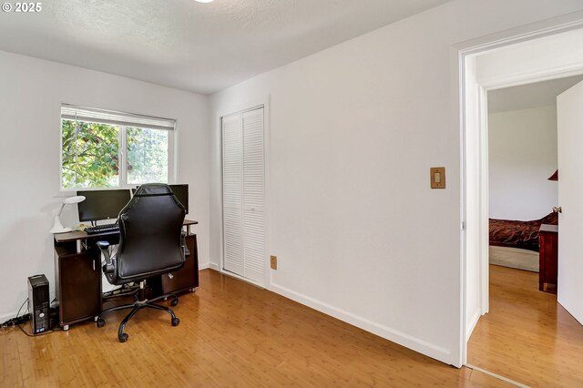 24221 Warthen Rd, Elmira, OR 97437 - home office featuring wood finished floors and baseboards