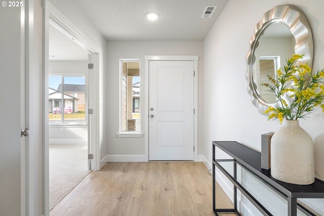 entrance foyer with light hardwood / wood-style floors