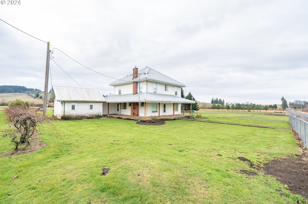 17084 Silver Falls Hwy SE, Sublimity, OR 97385 - farmhouse inspired home featuring covered porch, a rural view, and a front yard