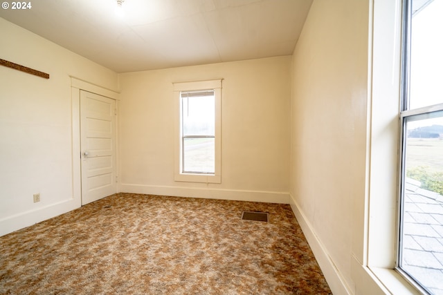 unfurnished room with carpet floors