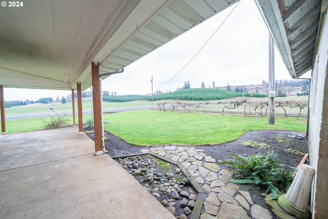 view of yard with a patio area and a rural view