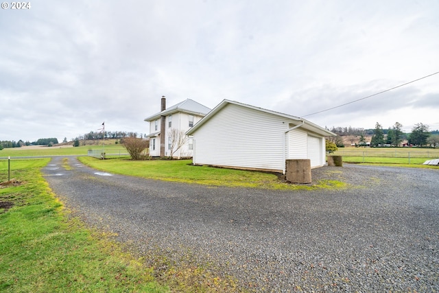 view of side of property featuring a lawn