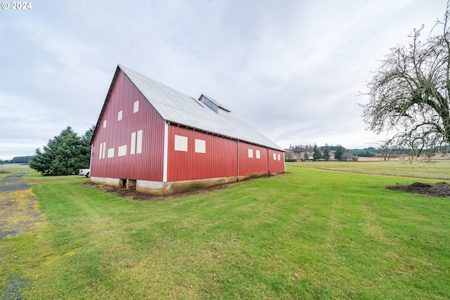 exterior space with an outbuilding and a yard