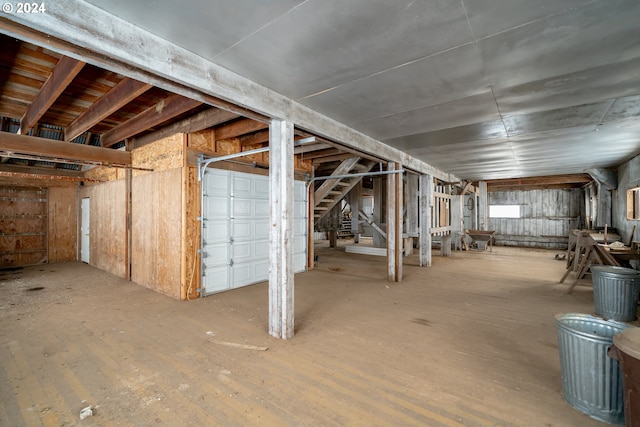 basement with hardwood / wood-style flooring