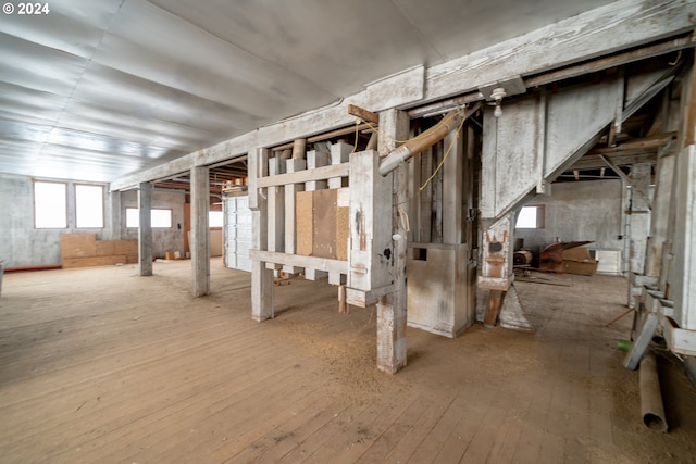 basement with hardwood / wood-style flooring