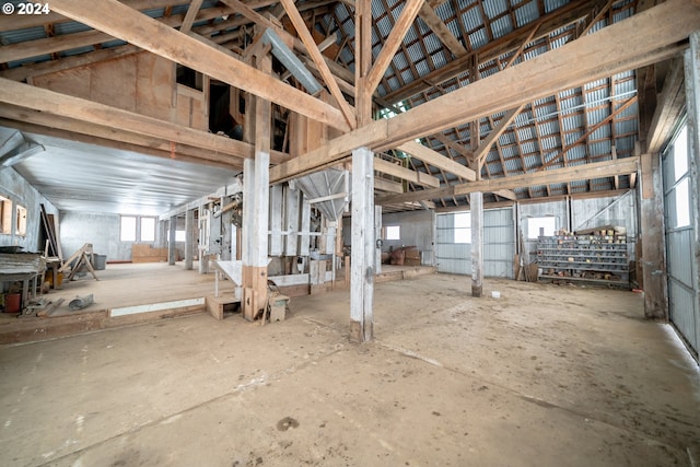 miscellaneous room featuring plenty of natural light and vaulted ceiling