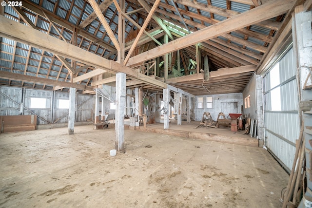 misc room featuring a healthy amount of sunlight and lofted ceiling