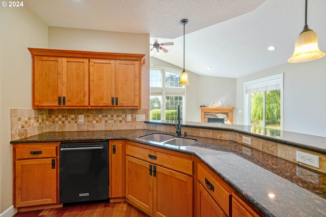 kitchen featuring lofted ceiling, a wealth of natural light, black dishwasher, and decorative backsplash