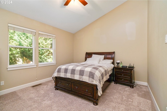 carpeted bedroom with ceiling fan and lofted ceiling