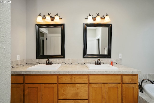 bathroom with a bathing tub and vanity