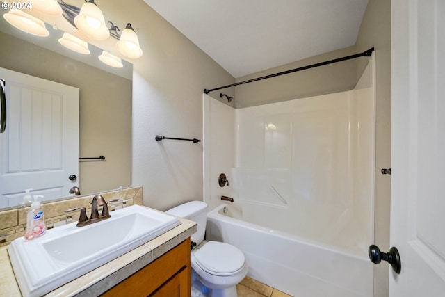 full bathroom with tile patterned floors, bathing tub / shower combination, vanity, and toilet