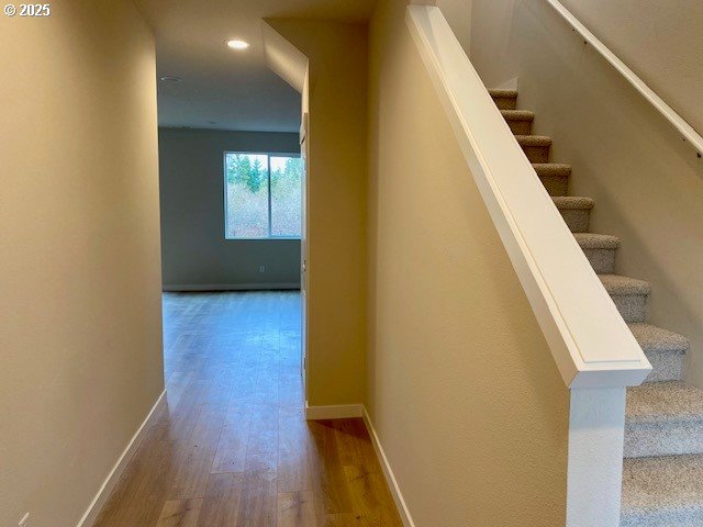 stairs with wood-type flooring