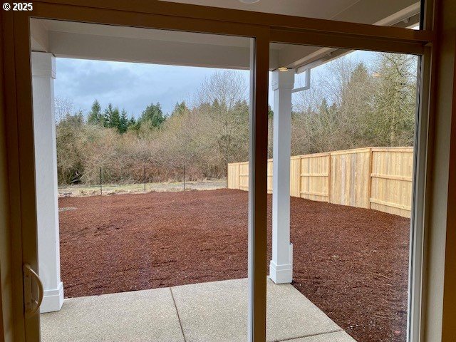 view of yard with a patio and fence