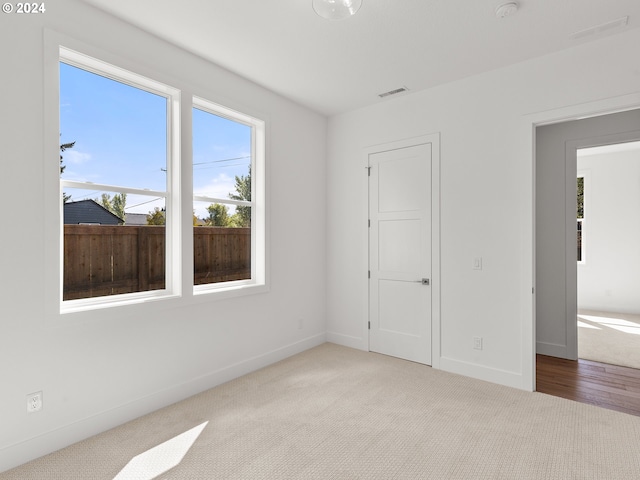 unfurnished bedroom with light carpet