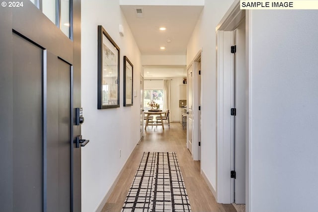 hallway featuring light hardwood / wood-style flooring