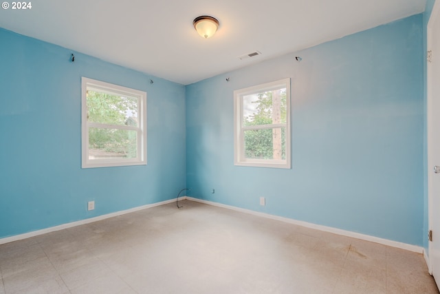 empty room featuring plenty of natural light