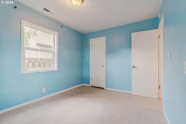 unfurnished bedroom with a closet