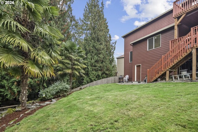 view of yard with a wooden deck