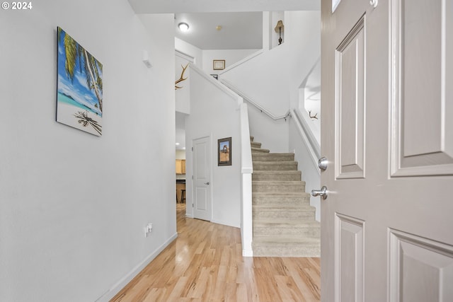 foyer entrance with light hardwood / wood-style floors