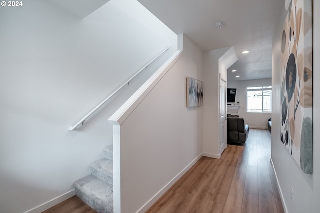 hallway with light wood-type flooring