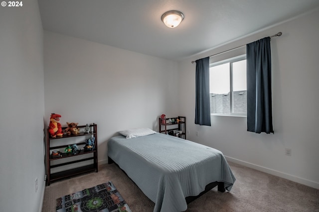 bedroom featuring carpet