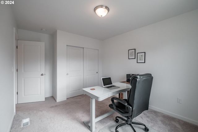 home office with light colored carpet