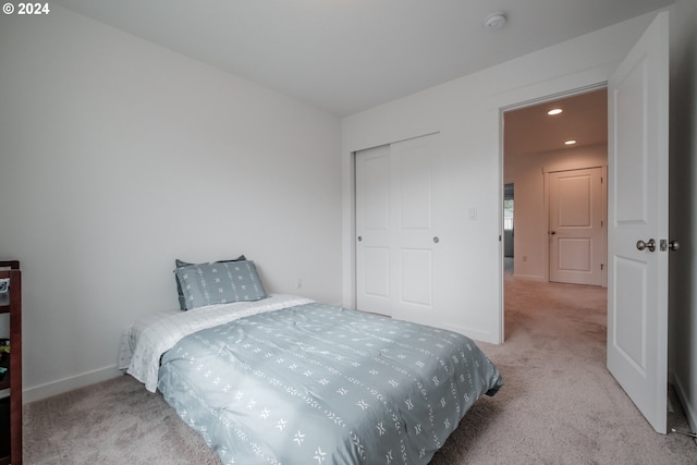 bedroom with light carpet