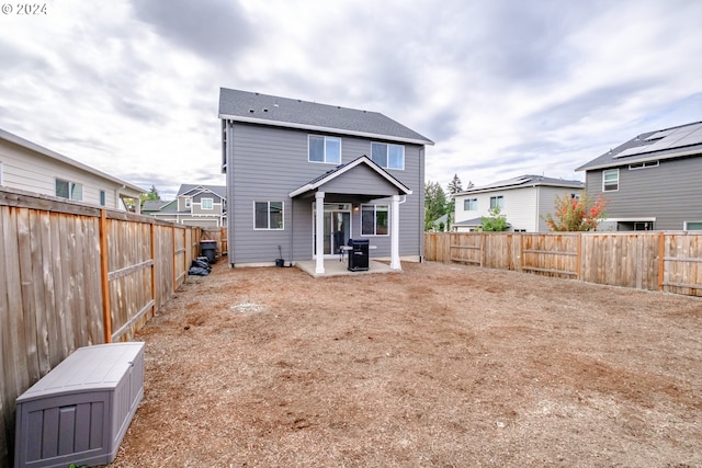 rear view of property with a patio