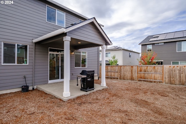 rear view of property featuring a patio area