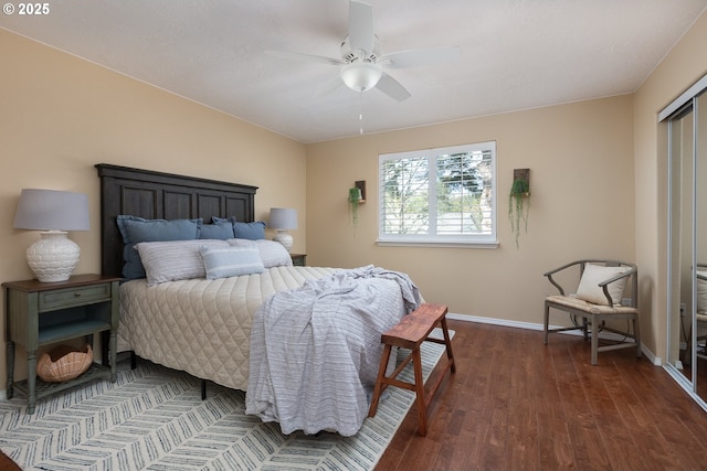 bedroom featuring baseboards, dark wood-type flooring, and ceiling fan