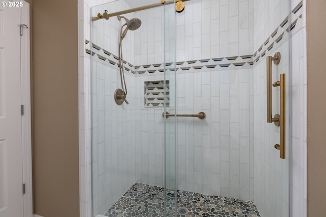 bathroom with a shower stall