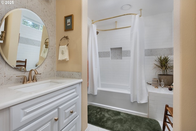 bathroom with vanity and shower / bathtub combination with curtain